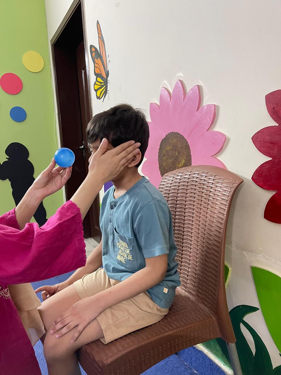 Child doing ABA attention exercise at Global Kids Campus Therapy Centre Lahore